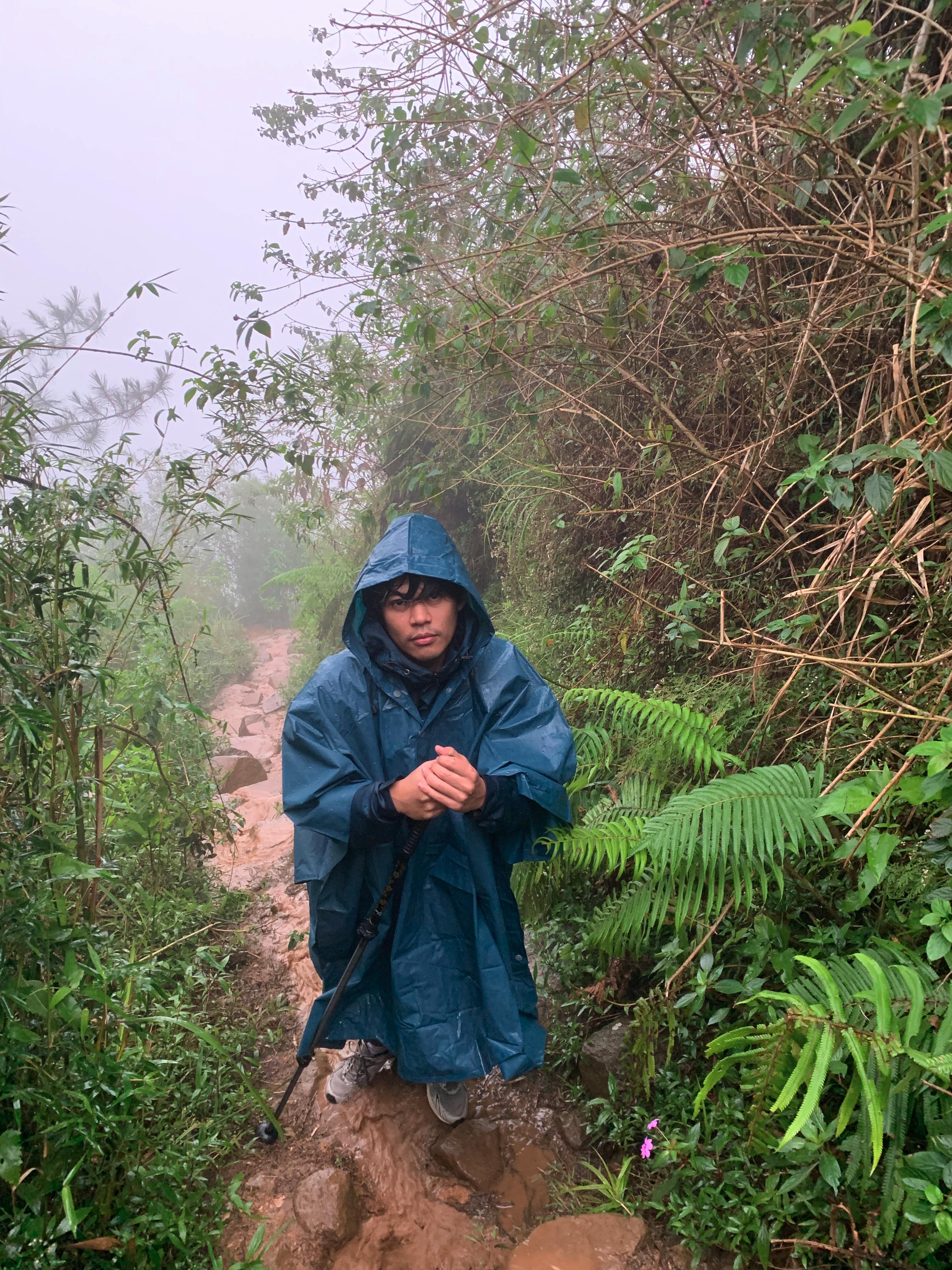 Navigating the muddy, rainy trail on the way down