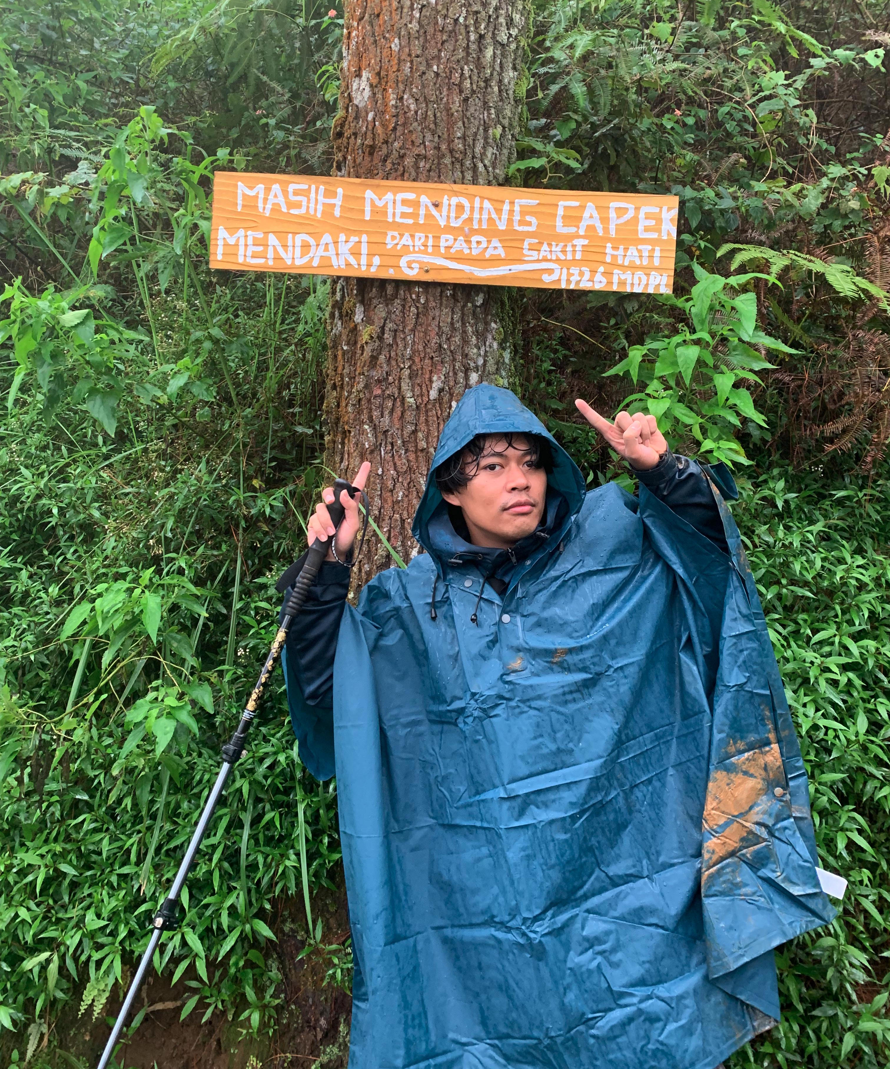 Classic hiking sign: "Masih mending capek mendaki, daripada sakit hati"
